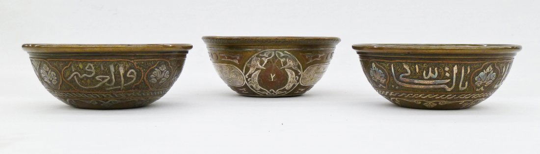 3pc Antique Islamic Mixed Metal Brass Bowls 2''x5'': 3pc Antique Islamic Mixed Metal Brass Bowls 2''x5'' Each Approx. Silver and copper inlaid cartouches with arabic calligraphy. 19th century.