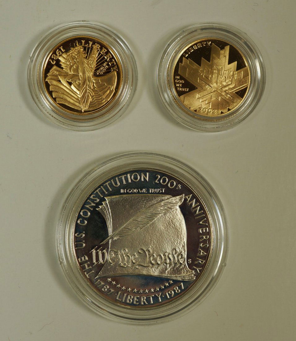 Two U.S. Mint gold and silver coin sets. Includes 1.: Two U.S. Mint gold and silver coin sets. Includes 1. 2002 Olympic Winter Games proof gold coin, $5 90% gold weighing 8.359g and 2. U.S. Constitution coins, 1987 silver dollar and gold five dollar coin