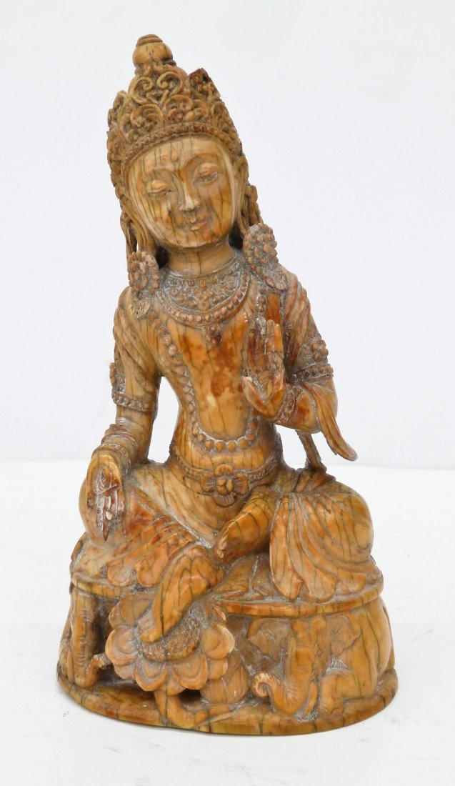 Antique Burmese or Thai Carved Ivory Seated Buddha: Antique Burmese or Thai Carved Ivory Seated Buddha 5.5''x3''. Ornately carved sitting on elephant throne with blossoming flowers. It weighs 270 grams. Some edge chipping to base. Southeast Asia, 18th 