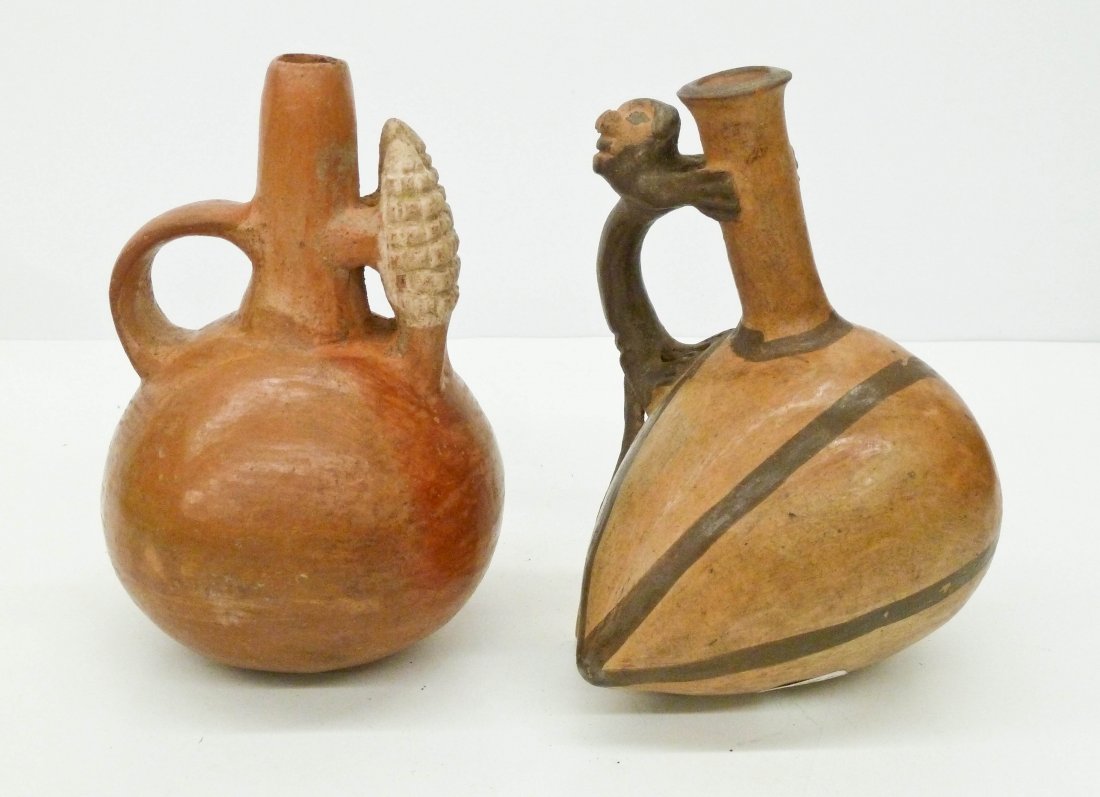 2pc Inca Small Ceramic Stirrup Vessels. Pre Columbian: 2pc Inca Small Ceramic Stirrup Vessels. Pre Columbian pots include a double corn husk 5.25''x3.5'' and a figural monkey on melon 5''x4''. Some slight chipping to spouts. Peru, 1400 to 1500 CE.