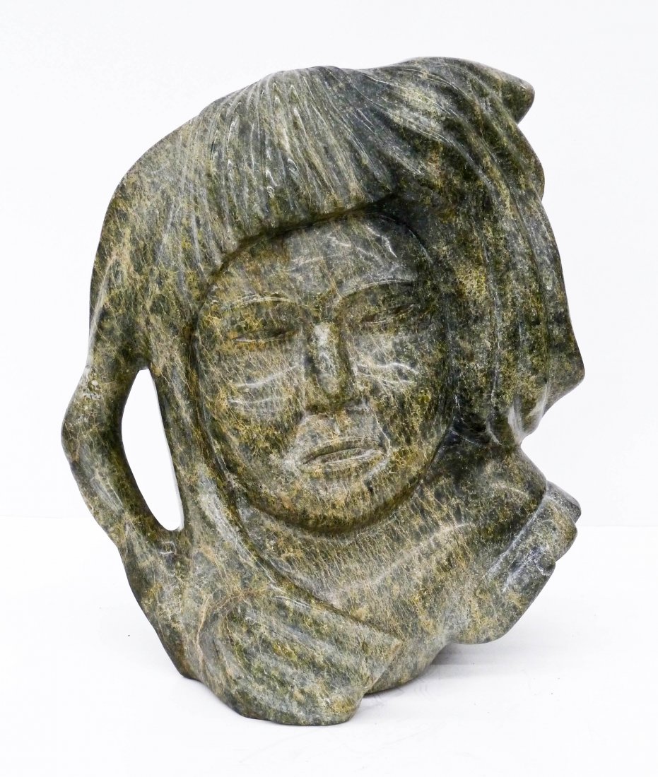 Kaka Ashoona (b.1928 Canada) Inuit Soapstone Carved: Kaka Ashoona (b.1928 Canada) Inuit Soapstone Carved Spirit Sculpture 14''x13''x7''. Cape dorset green soapstone bust sculpture. Accompanied by binder of information about the artist including photos o