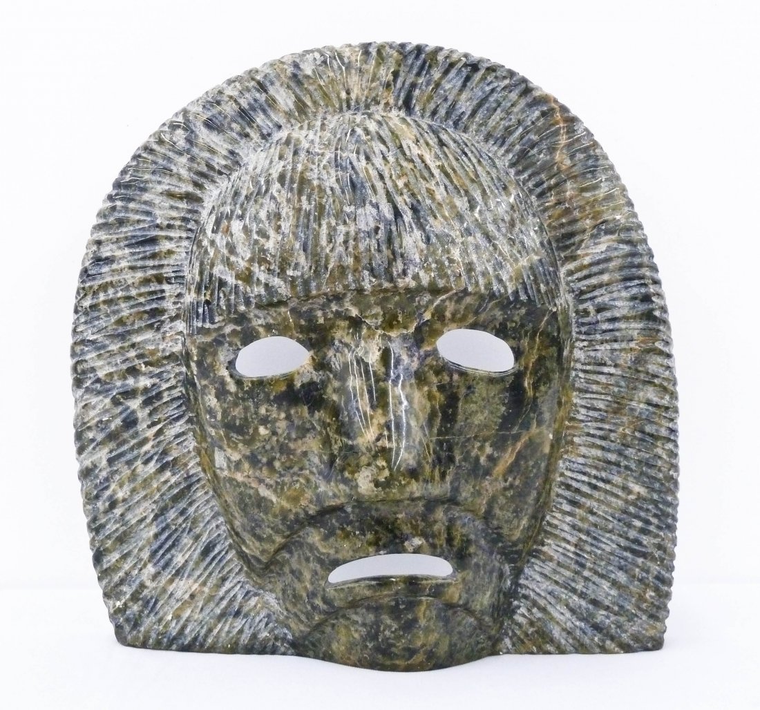 Taqialuq Tuk Nuna (b.1958 Canada) Inuit Carved: Taqialuq Tuk Nuna (b.1958 Canada) Inuit Carved Soapstone Mask 9''x9''. Deeply carved and polished green soapstone. Signed on verso. Excellent condition.