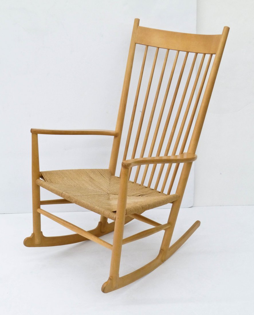 Hans Wegner Spindle Back Rocking Chair: Hans Wegner Beechwood Spindle Back Rocking Chair 43''x25''x31''. Woven seat rocker with overall light wear. Marked "Made in Denmark" and dated 1984.
