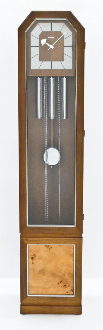George Nelson for Howard Miller Grandfather Clock: George Nelson for Howard Miller Grandfather Clock 71''x14.5''x9''. Model 620-807 with walnut case and stainless dial. Three weight movement with westminster chime. Running order. Some scattered scratc
