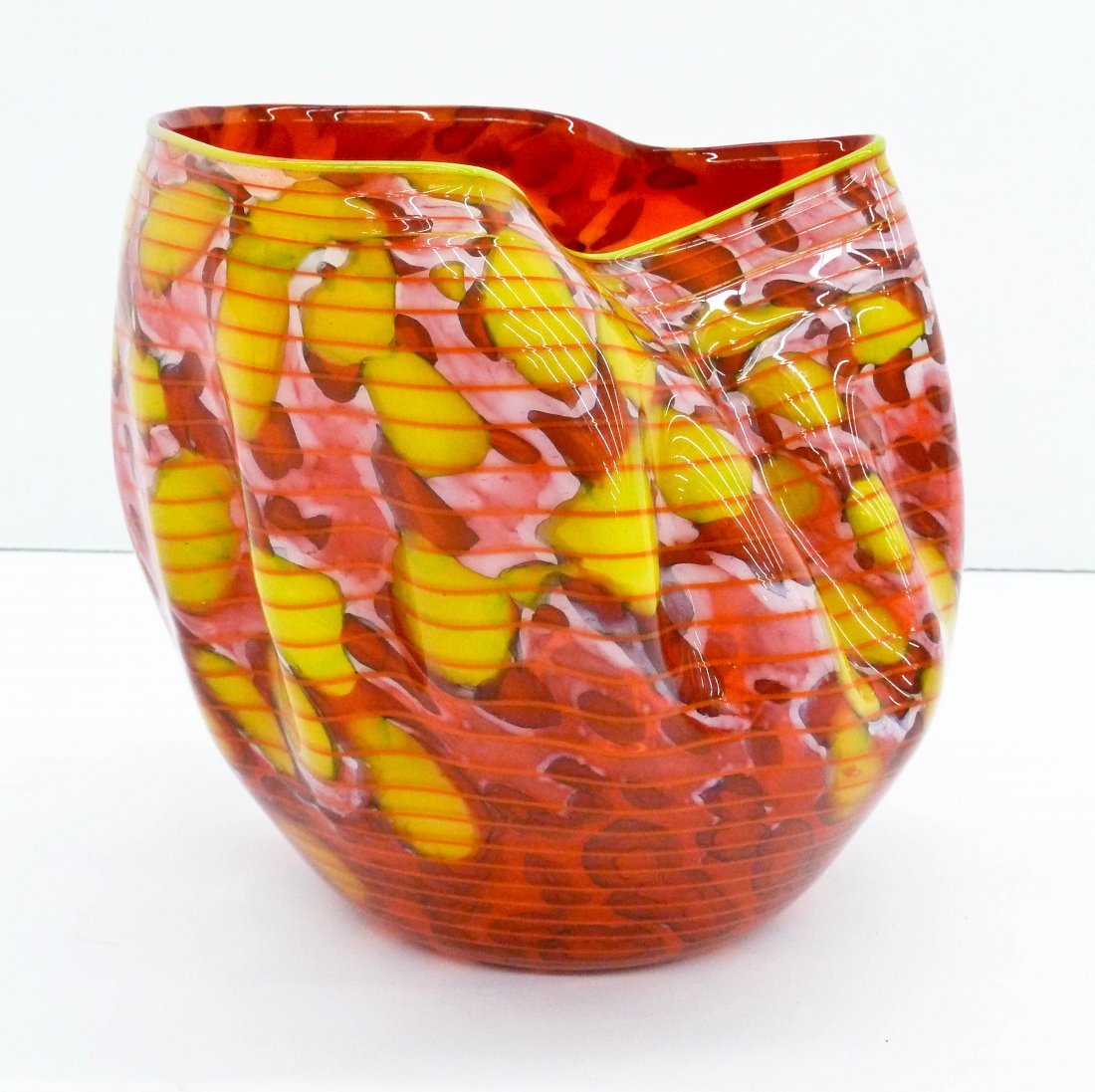 Dale Chihuly (b.1941 American) Red Macchia with Yellow: Dale Chihuly (b.1941 American) Red Macchia with Yellow Lip Wrap 1999 Art Glass Bowl 6.75''x6.5''. Pinkish red and yellow coloring with orange threading throughout. Signed and dated on bottom. This is 