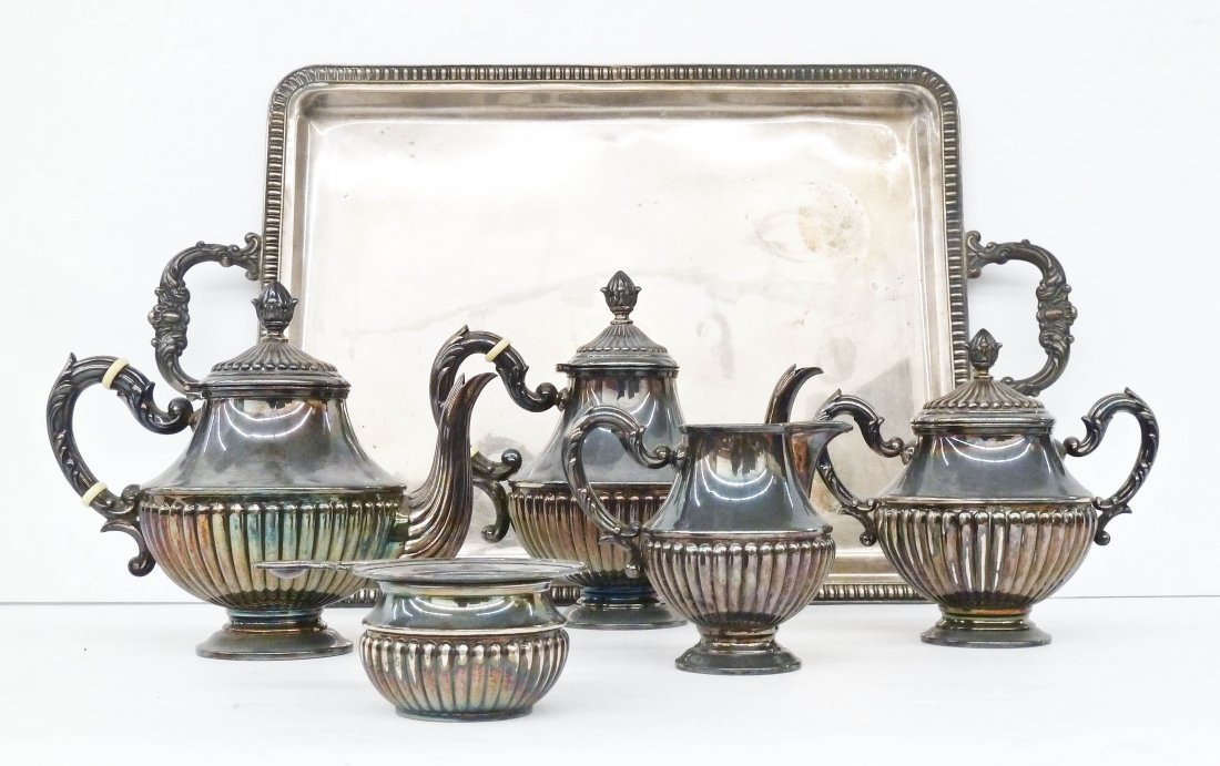 6pc Spain .915 Silver Tea Service. Includes a 23'': 6pc Spain .915 Silver Tea Service. Includes a 23'' service tray, teapot, coffee pot, sugar, creamer, and tea strainer with stand. Set weighs a total of 100.9 troy ounces. Vintage spanish sterling.