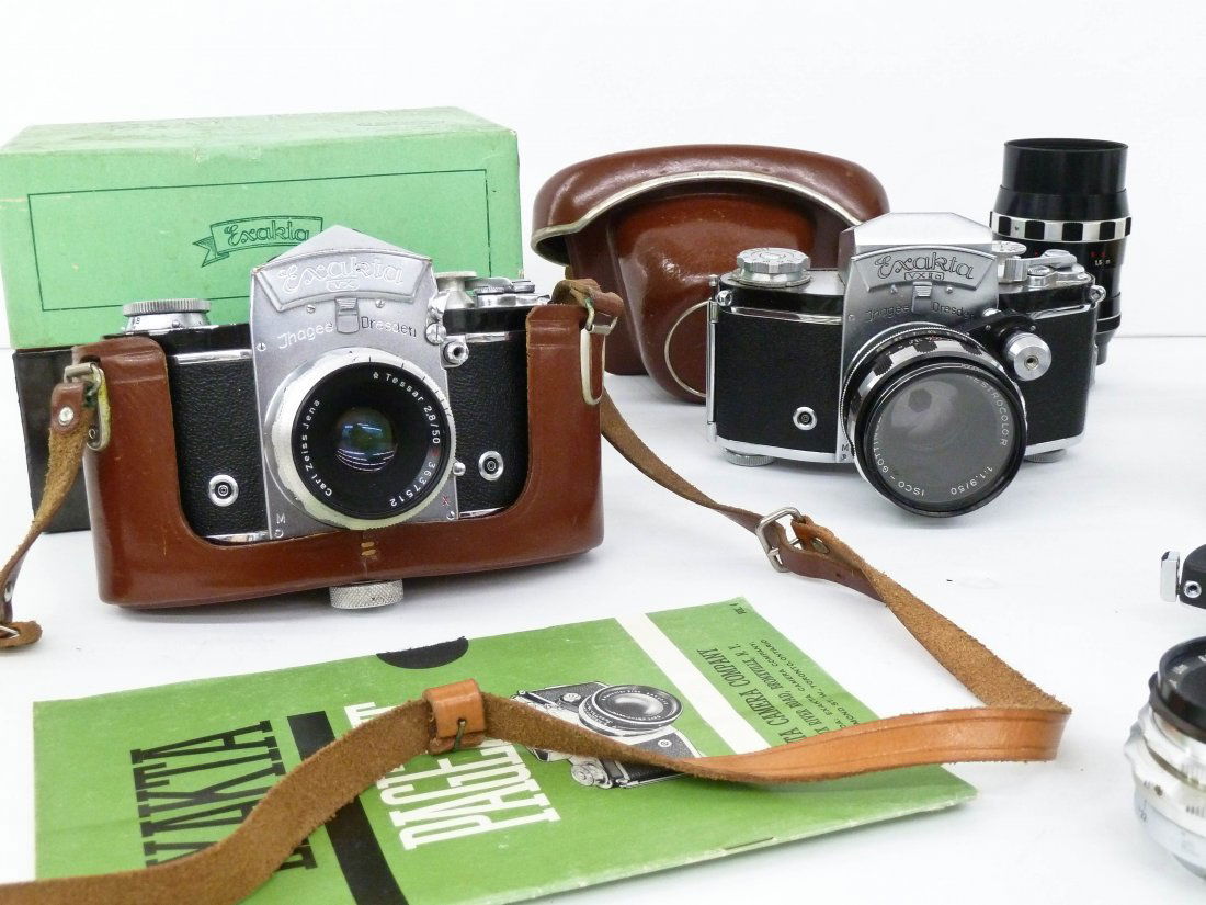 Group of Vintage Exakta Thagee Dresden Cameras and: Group of Vintage Exakta Thagee Dresden Cameras and Lenses. Two camera bodies, one with original cardboard box. Lenses include Carl Zeiss Tessar 2.8/50mm, Zeiss Triotar 1:4/13.5cm, Steinheil Auto-Quina