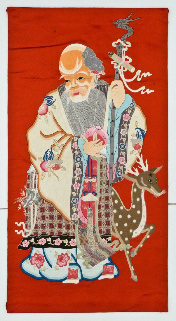 Antique Chinese Shou Lao Silk Embroidered Panel: Antique Chinese Shou Lao Silk Embroidered Panel 56''x29.5''. Fine polychrome silk work against a coral red ground. A few scattered small stains. 19th/20th century, Qing dynasty.