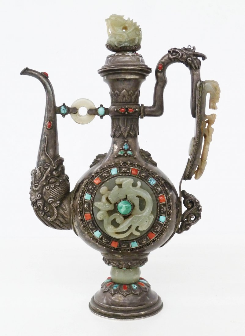 Antique Chinese Mongolian Silver & Jade Dragon Teapot: Antique Chinese Mongolian Silver & Jade Dragon Teapot 11.25''x7''. Intricately chased figural dragon spout and handle with applied jade fittings. Dragon celadon jade belt hook on handle with duck pend
