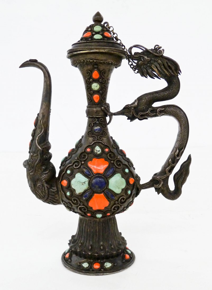 Antique Chinese Mongolian Silver Dragon Teapot: Antique Chinese Mongolian Silver Dragon Teapot 8.75''x6''. Ornately chased figural five clawed dragon handle and head spout. Applied lapis lazuli, turquoise, and coral beading throughout exterior. Exc