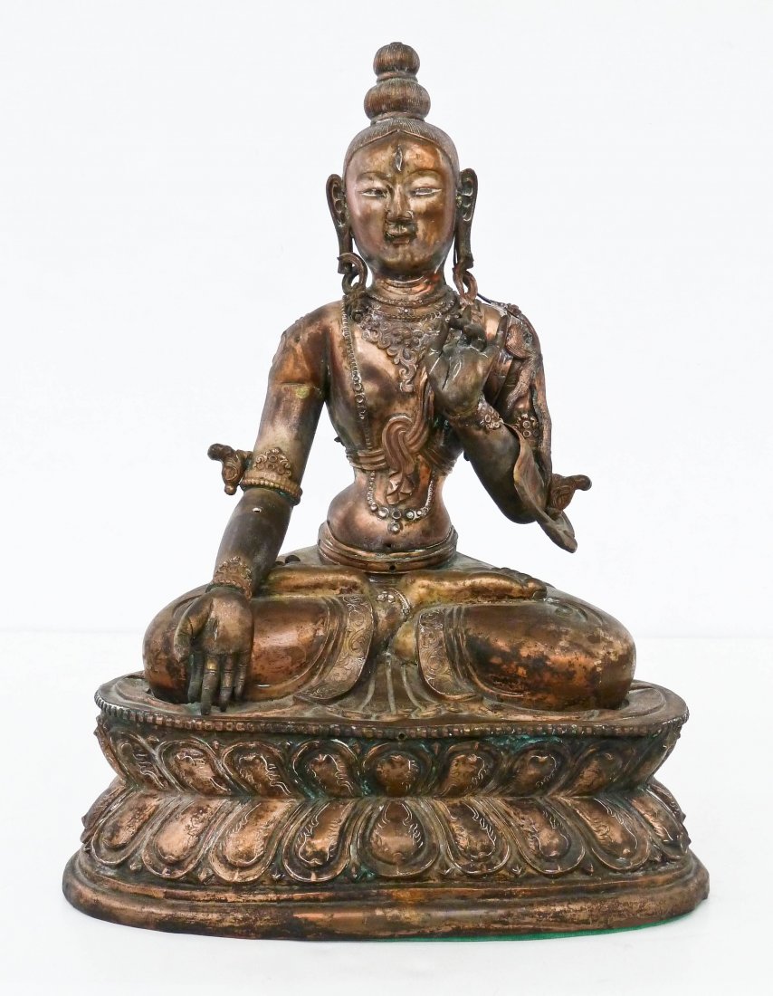 Antique Chinese Seated Copper Buddha on Lotus Base: Antique Chinese Seated Copper Buddha on Lotus Base 14''x10''. Intricately chased with repousse floral motifs and scrollwork. Hollow body constructed in several parts. Missing piece from left arm and f