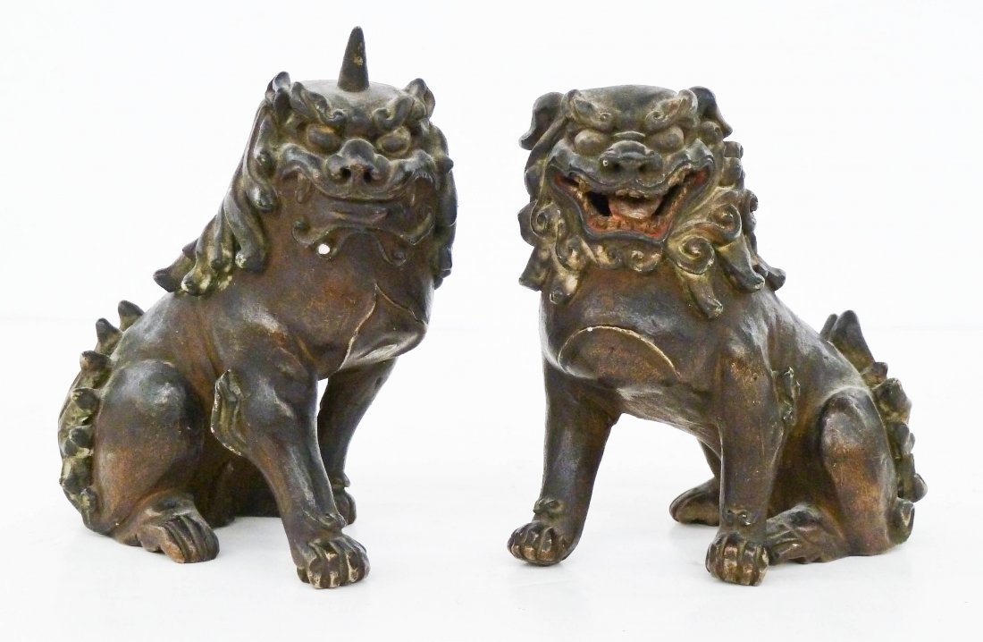 Pair Japanese Foo Dog Porcelain Figures 4.5''x4'' Each.: Pair Japanese Foo Dog Porcelain Figures 4.5''x4'' Each. Fierce foo lions covered in a dark brown glaze. Each has incised kanji marks underneath. A few small edge chips. Edo or Meiji period, 19th centu