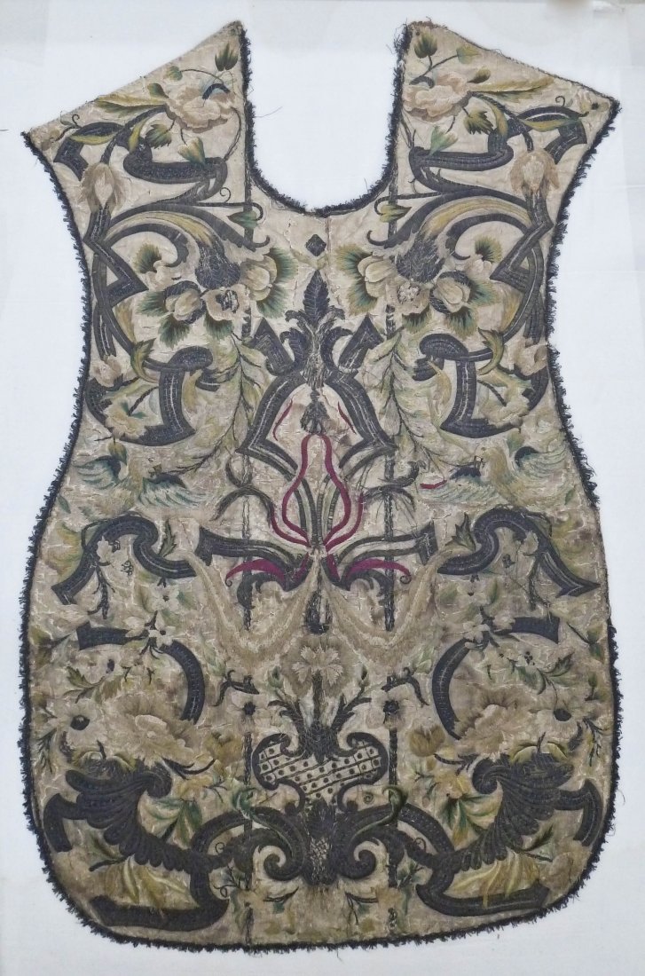 Italian 17th Century Silk Embroidered Chasuble Vestment: Italian 17th Century Silk Embroidered Chasuble Vestment Piece 40''x25''. Polychrome silk with silver thread. Various small tears and edge fray. Total framed size 48.5''x33.5''.