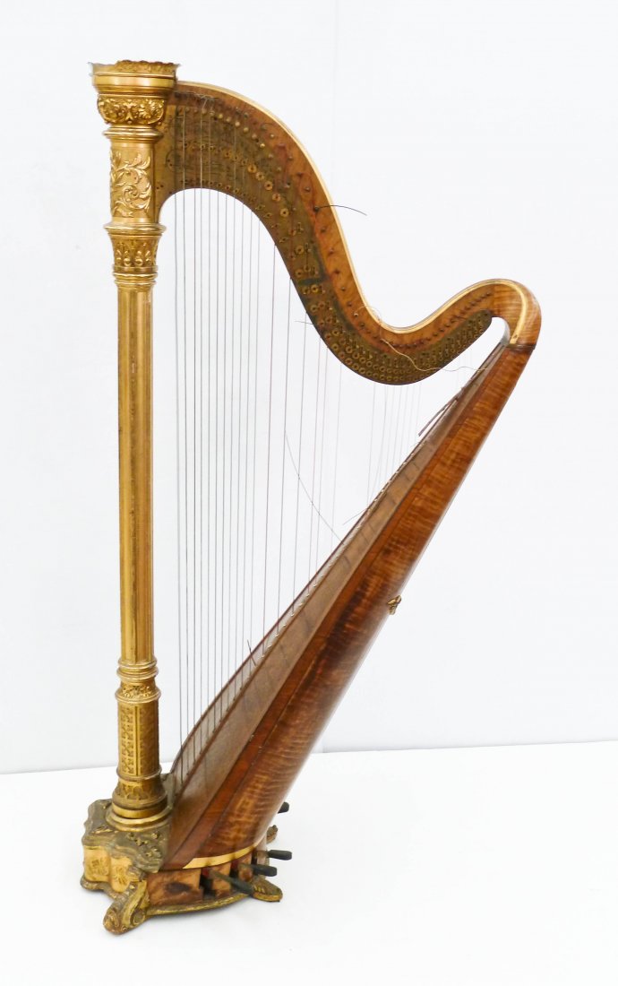 Antique Lyon & Healy Chicago Gilt Carved Concert Harp: Antique Lyon & Healy Chicago Gilt Carved Concert Harp 70''x38''. Comes with fitted wood crate. Serial number 1151. Missing piece to ornament at top edge. Good overall condition.