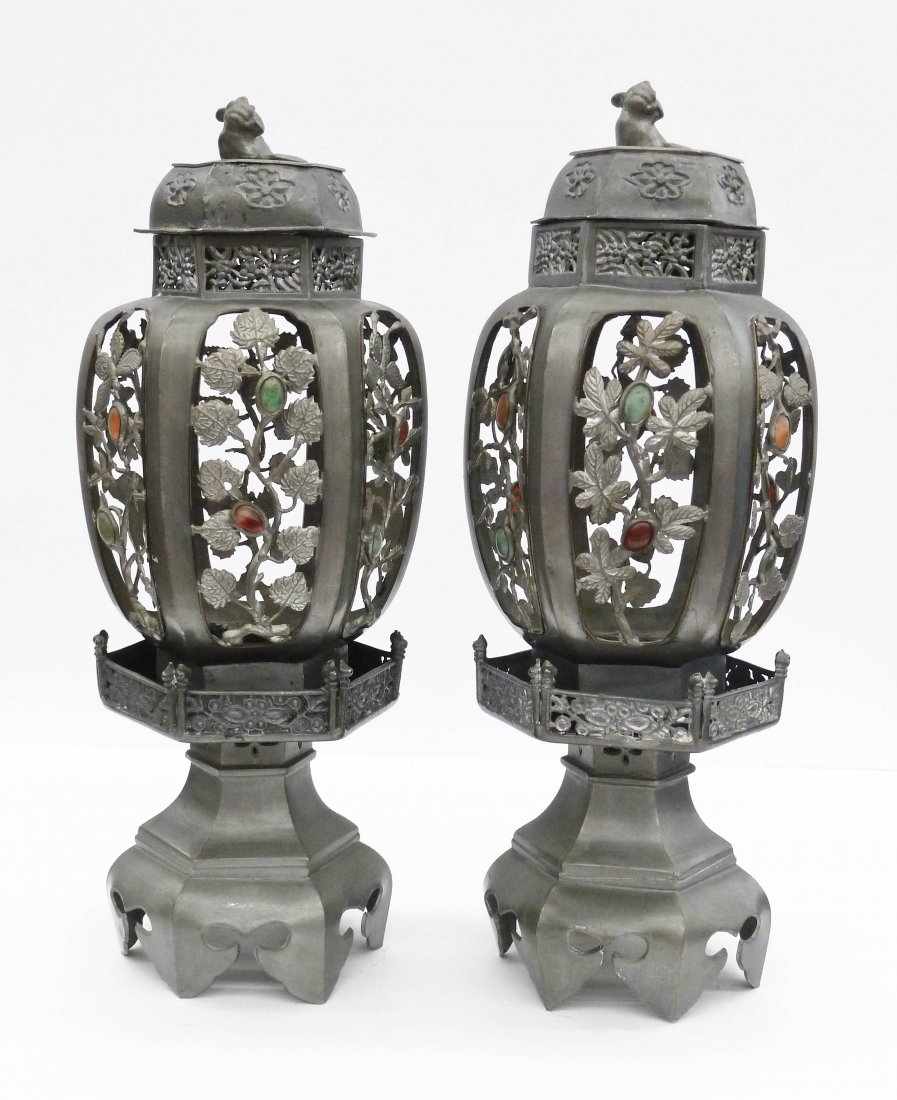 Pair of Antique Chinese Pewter Candle Lanterns 16''x6'': Pair of Antique Chinese Pewter Candle Lanterns 16''x6'' Each. They have a figural foo lion finial with inset jade, carnelian, and agate cabochons. A couple broken leaves to side panels. 19th century, 