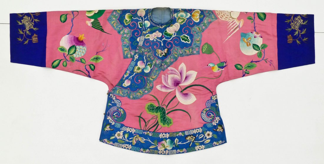 Antique Chinese Pink Mandarin Silk Embroidered Robe: Antique Chinese Pink Mandarin Silk Embroidered Robe 33''x69''. Depicts large blossoming lotus flowers and pomegranates against a stark pink ground. Lush polychrome butterfly, bat and peach motifs on t