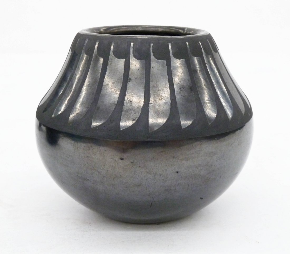 Maria & Santana Martinez Gunmetal Feather Pot: Maria & Santana Martinez Gunmetal Feather Pot 3.25''x4''. San ildefonso blackware pottery with unusual gun metal finish. Incised ''Maria + Santana'' on bottom. Excellent condition with some light scra