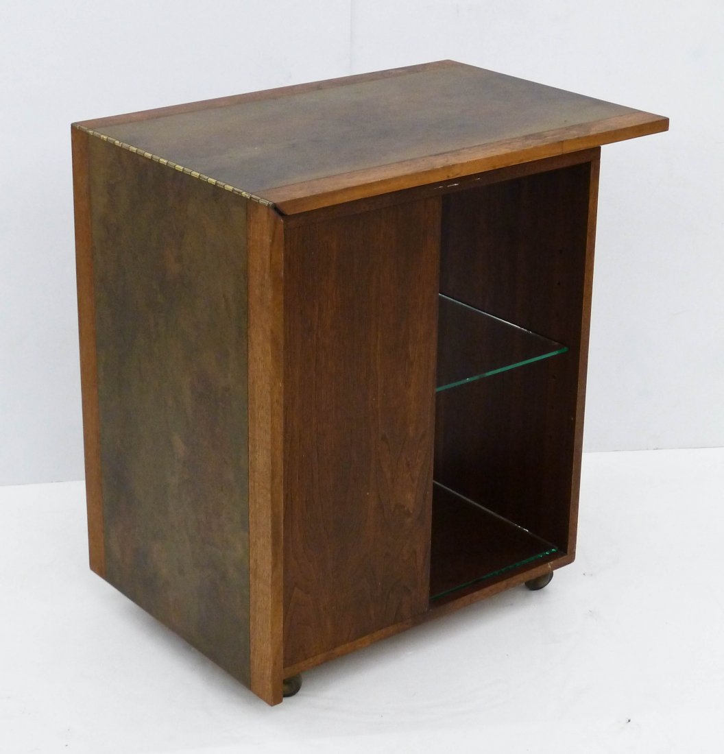 Harry Lunstead Design Portable Bar 30.5''x28''x19''.: Harry Lunstead Design Portable Bar 30.5''x28''x19''. Walnut with patinated brass top and glass shelves. Top folds to 56'' with hidden interior shelving. Overall wear.