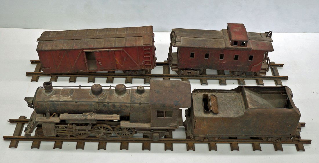 Buddy L Pressed Steel Outdoor Railroad including 24.5'': Buddy L Pressed Steel Outdoor Railroad including 24.5'' Engine, 17'' Tender, 20.5'' Box Car, 18'' Caboose & 8 sections of 48'' Straight Track, Poor to Fair Condition with rusted undersides, pitting, e