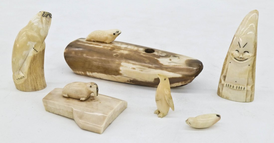 6pc Alaskan Eskimo Ivory Carvings. Includes a: 6pc Alaskan Eskimo Ivory Carvings. Includes a fossilized seal tusk pen holder 6.5'', a walrus on slab 3'', a walrus on rock 3.5'', a billiken figure 3.75'', an early standing penguin 2'', and a small 