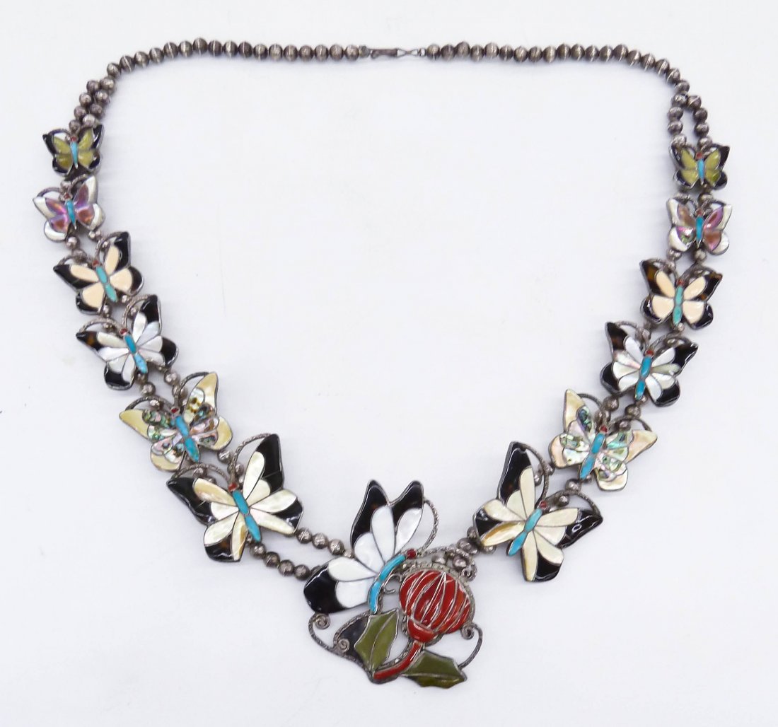 Zuni Butterfly Inlaid Silver Squash Blossom 29''.: Zuni Butterfly Inlaid Silver Squash Blossom 29''. Colorful and intricate channel inlaid butterflies of graduated size. Central pendant measures 3''x2.5'' and has turquoise, coral, and abalone shell in