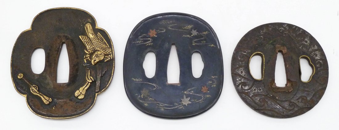 3pc Antique Japanese Tanto Tsubas. Lot includes a: 3pc Antique Japanese Tanto Tsubas. Lot includes a shakudo damascene decorated maple leaf tsuba 2.75''x2.5'', a shakudo relief bird decorated tsuba 2.75''x2.5'', and an iron wave decorated tsuba 2.5''x