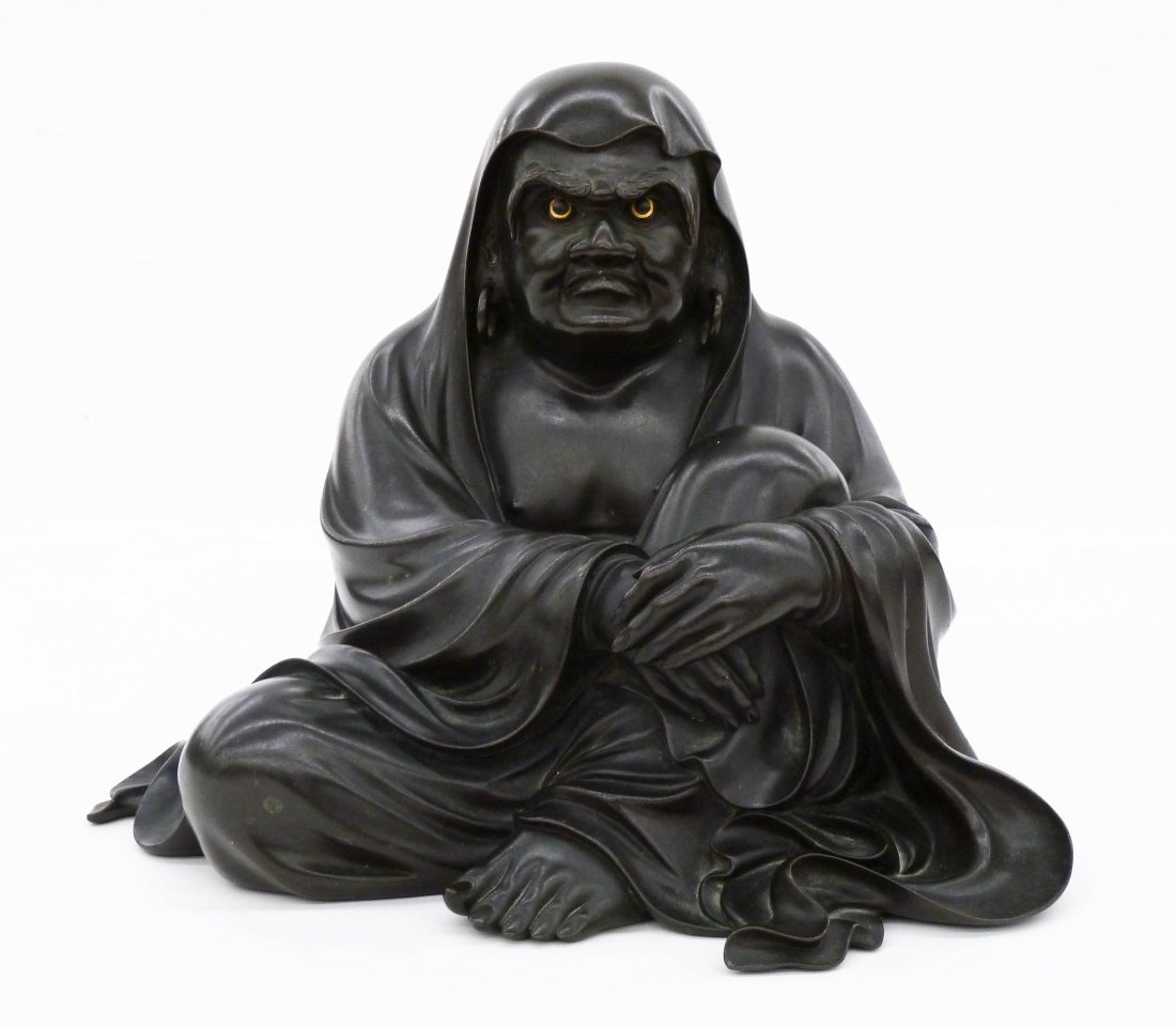 A Fine Japanese Seated Daruma Bronze Okimono by: A Fine Japanese Seated Daruma Bronze Okimono by Takahashi Ryoun 10.5''x13''x10.5''. Intricate cast bronze buddhist monk figure with gold inlaid eyes. Signed with his seal on bottom. Overall excellent 