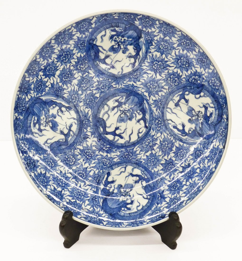 Antique Japanese Arita Porcelain Dragon Charger: Antique Japanese Arita Porcelain Dragon Charger 18.5''x2.5''. Hand decorated blue underglaze motif of five dragons in medallions. Excellent condition. 19th century, Meiji period. Search terms: imari, 