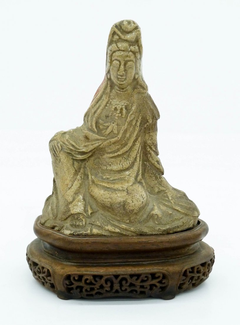 Antique Chinese Yixing Guanyin Figure on Stand: Antique Chinese Yixing Guanyin Figure on Stand 4.5''x3.5''. A molded buff colored clay figure of a reclining guanyin. Impressed artist seal on interior. Comes on a fine fitted pierced rosewood stand. 