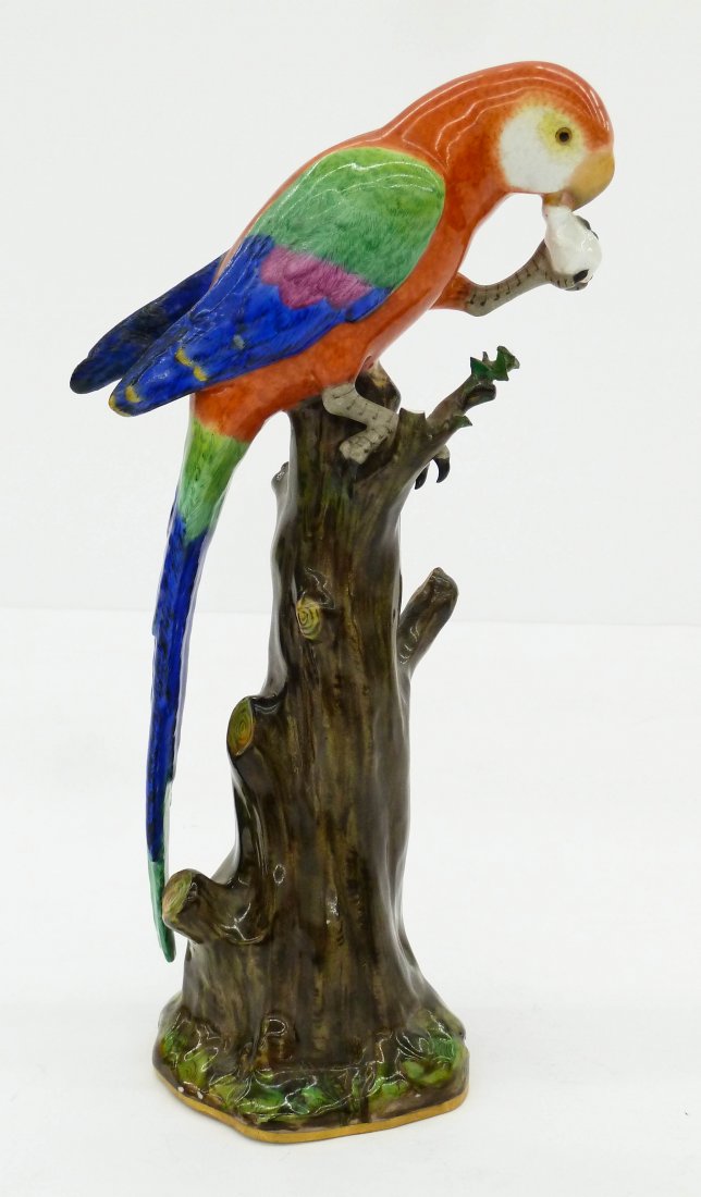 Antique Meissen Parrot in Tree Porcelain Figurine: Antique Meissen Parrot in Tree Porcelain Figurine 11''x5.5''. A polychrome decorated macaw bird model perched on stump branch. Chipping to one branch and end of long tail. One wing has old repair also