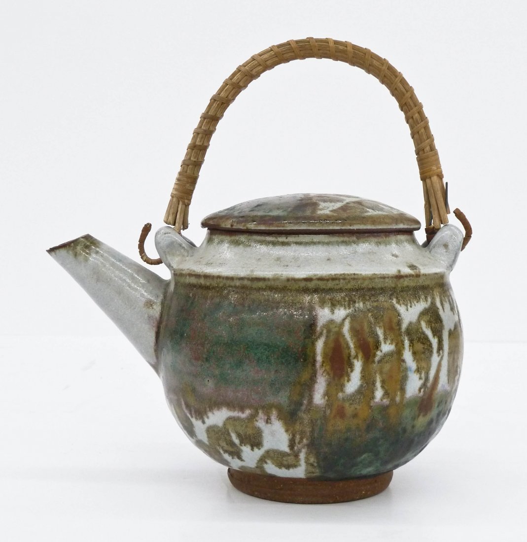 Robert Sperry (1927-1998 Washington) Stoneware Teapot: Robert Sperry (1927-1998 Washington) Stoneware Teapot 8.5''x8.5''. Wheel thrown with his typical checkered glaze motifs. Signed in glaze on bottom. Slight chipping to spout, otherwise excellent condit