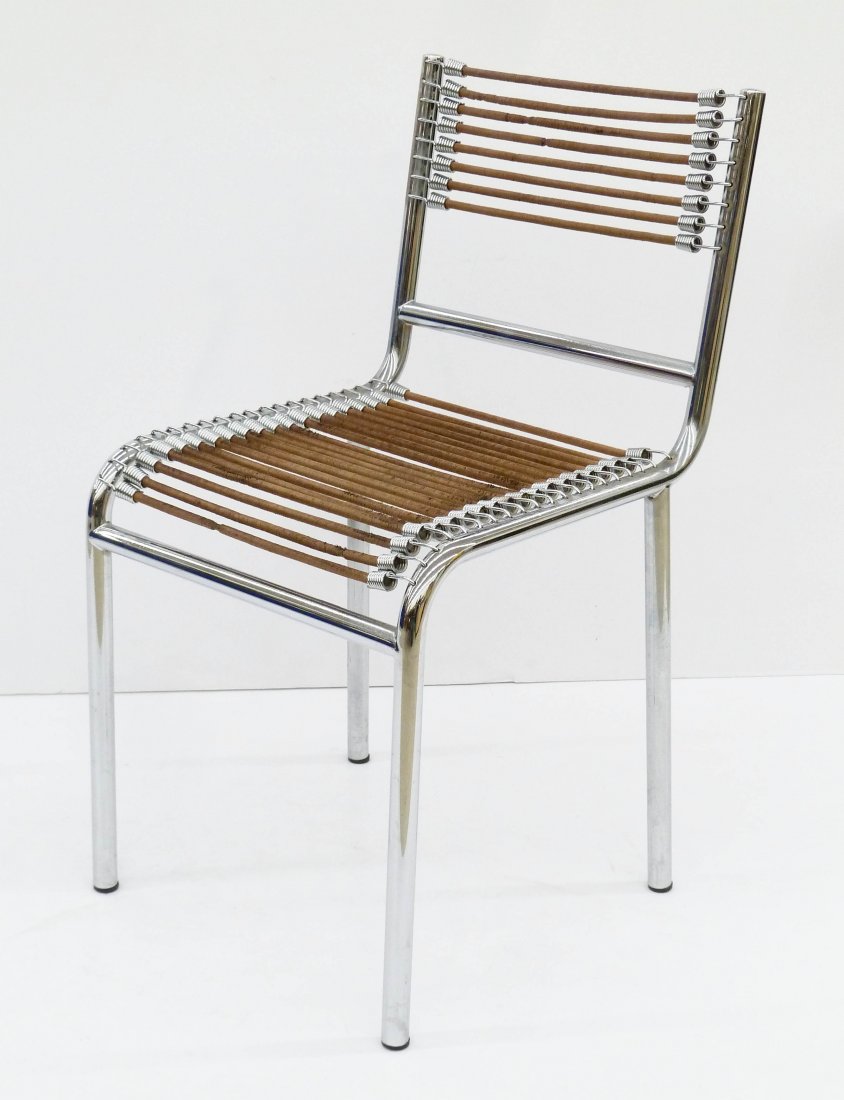 Rene Herbst ''Sandows'' Chair 32''x16.5''x19.25''. A: Rene Herbst ''Sandows'' Chair 32''x16.5''x19.25''. A vintage example composed of tubular metal with sandow elastic rubber stretcher belts. Manufactured by Etablissements. Light overall wear. Mid centu