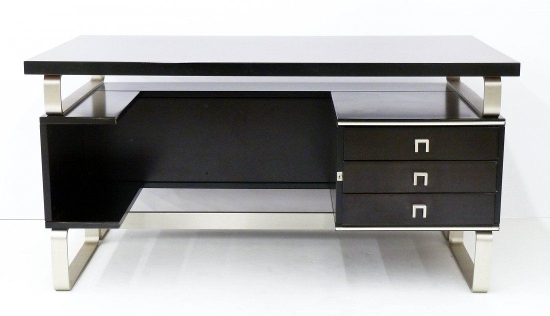 ABBONDInterni Italian Executive Desk: ABBONDInterni Italian Executive Desk 28.5''x57''x31.5''. A designer desk of mahogany and aluminum construction. Three drawers in front with bookcase shelf on back. Impressed logo on aluminum. Excellen