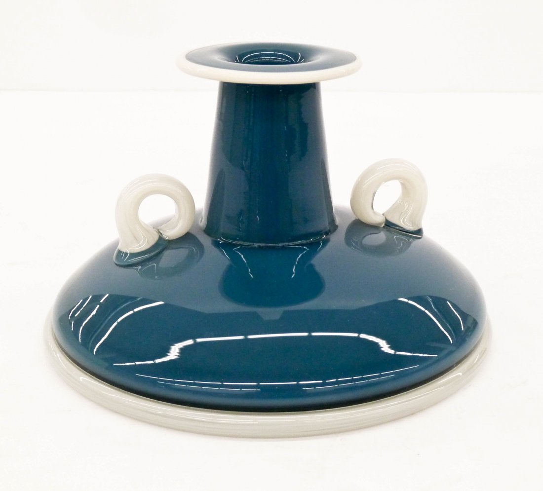 Preston Singletary (b.1964 Washington) Prestonuzzi: Preston Singletary (b.1964 Washington) Prestonuzzi Squat Vase 1995 Studio Glass 4.5''x7.25''. Sea blue body with opaque lip wrap and handles. Signed and dated on bottom. Excellent condition. Native Am