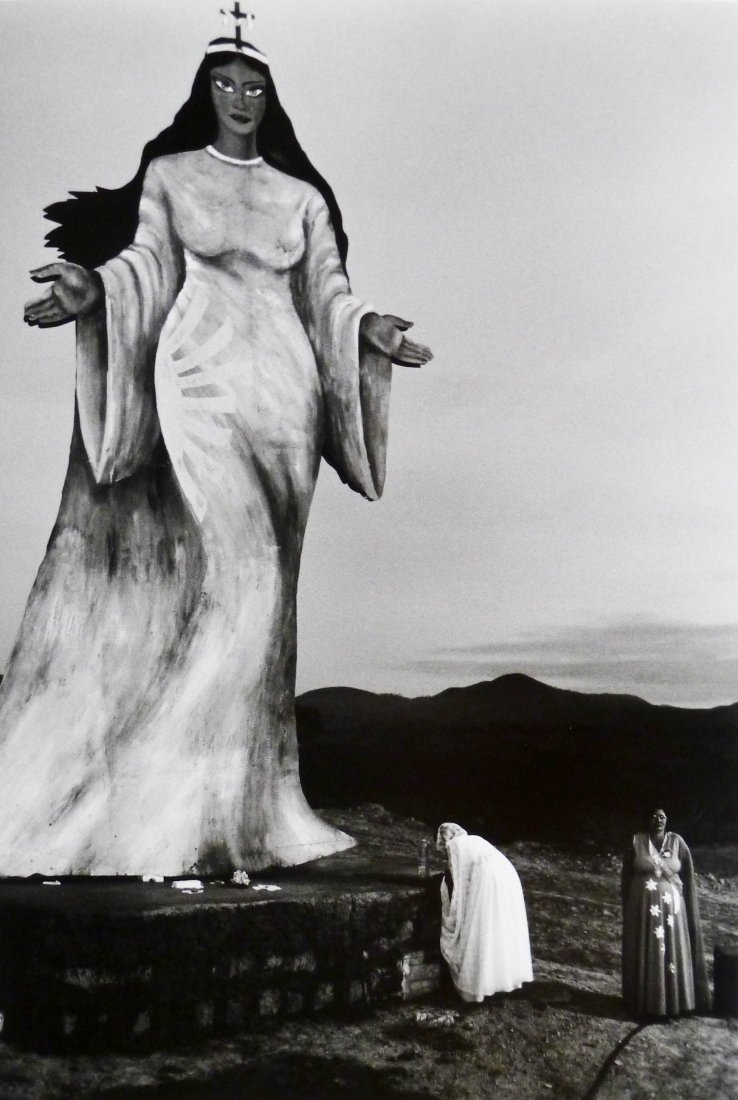 Sebastiao Salgado (b.1944 American) ''Two Women Making: Sebastiao Salgado (b.1944 American) ''Two Women Making Offerings to a Statue of a Goddess, Brazil'' 1980 Gelatin Silver Print 11''x7.5'' Image. Photograph is signed and dated in pencil on verso. Sheet