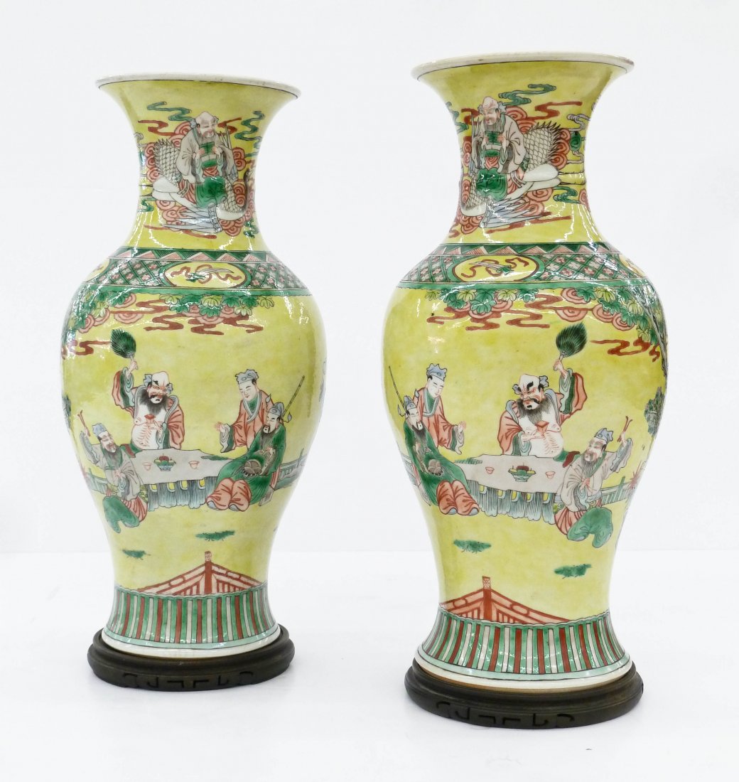 Pair of Antique Chinese Famille Jaune Porcelain Vases: Pair of Antique Chinese Famille Jaune Porcelain Vases 16.5''x8'' Each. Polychrome enameled with two scenes of immortal in landscape with attendants. Buddhist objects around neck with immortal riding b