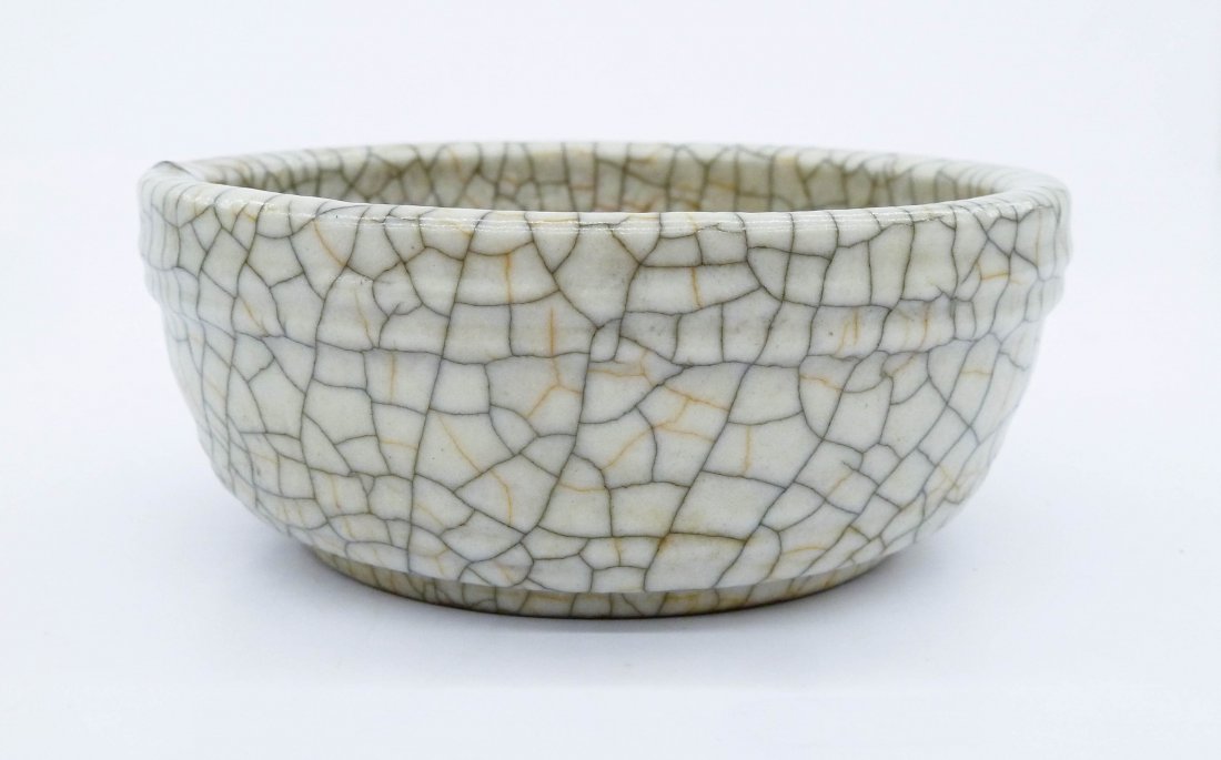 A Chinese Geyao Porcelain Brush Washer 1.75''x4.25''. A: A Chinese Geyao Porcelain Brush Washer 1.75''x4.25''. A round form with controlled crackle glaze. The bottom has a ''T.C.M. O'Donovan Collection'' and unknown ''P+B'' retailer label. Overall excellent