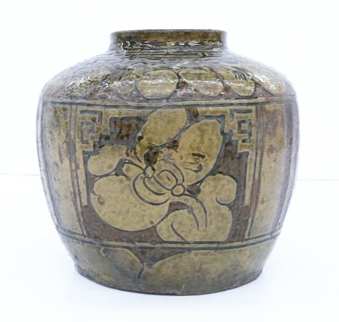 Chinese Ming Decorated Stoneware Storage Jar: Chinese Ming Decorated Stoneware Storage Jar 8.5''x9.5''. Decorated with three panels of carved blossoming flowers in glaze. Overall excellent condition. 16th century, Ming dynasty. Martaban, Henan.