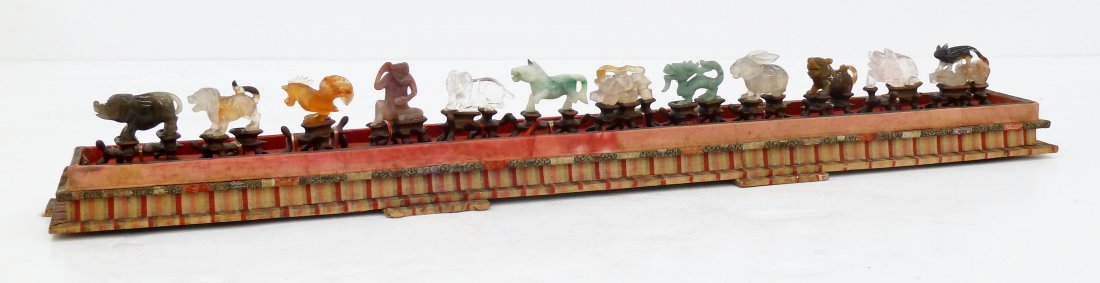 Antique Chinese Hardstone Signs of The Zodiac in Fitted: Antique Chinese Hardstone Signs of The Zodiac in Fitted Box 4''x22''. Complete set of miniature carved hardstone zodiac animals on fitted carved rosewood stands. It includes jade, carnelian, rose quar