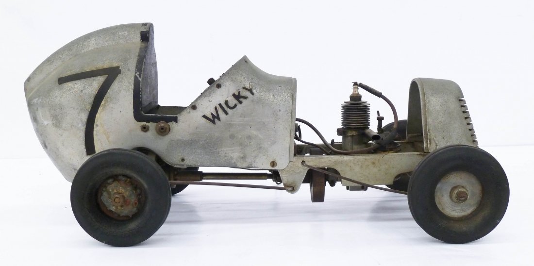 Vintage Speed Chief Tether Racer with Brown Junior: Vintage Speed Chief Tether Racer with Brown Junior Motors Engine 8.5''x20''. Gas powered race car toy with Speed Chief Seiberling rubber tires. Aluminum body. Overall wear from age and in non-working 
