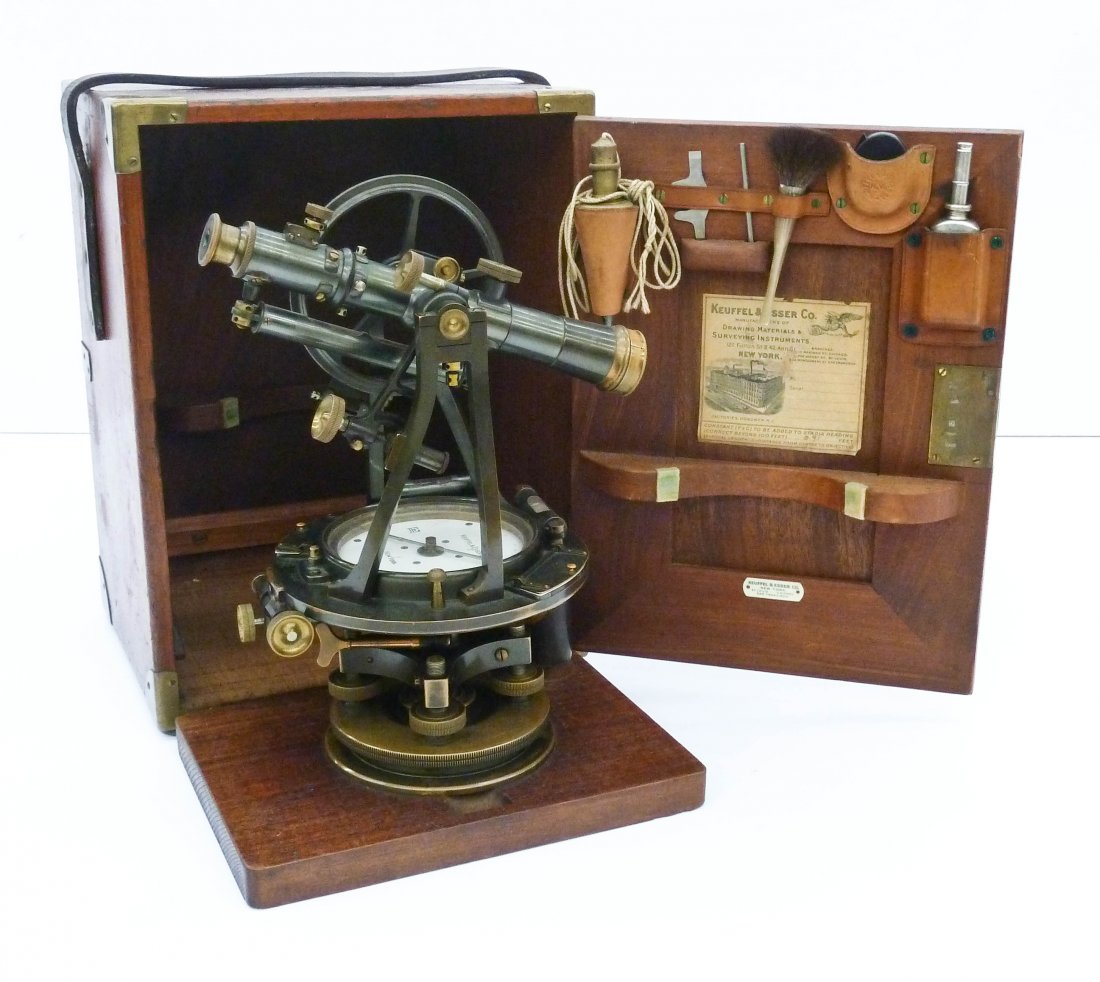 Vintage Keuffel & Esser Co. Surveyor's Transit in Case: Vintage Keuffel & Esser Co. Surveyor's Transit in Case 14''x10.5''. Brass transit is numbered 8414 and measures 12''x7'' by itself. Original case with paper label and plumb bob. Overall excellent cond