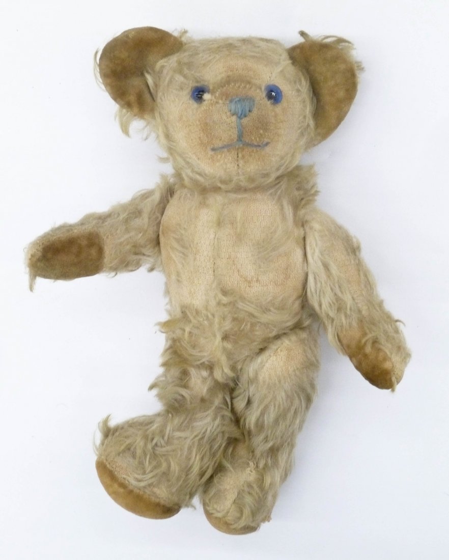 Antique Mohair Jointed Teddy Bear 10''. Golden white: Antique Mohair Jointed Teddy Bear 10''. Golden white mohair with blue glass eyes and blue needlework nose. Felt end paws and ears. Possibly a Steiff petsy bear. Scattered wear and loss to mohair. Germ