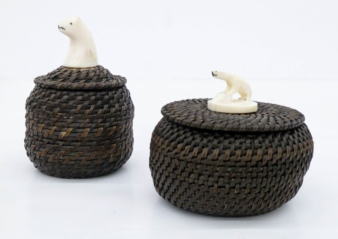 2pc Alaskan Eskimo Baleen Covered Baskets. Includes a: 2pc Alaskan Eskimo Baleen Covered Baskets. Includes a basket by John Long with carved ivory polar bear head finial 4.5''x3''. Also an unsigned basket with full figure polar bear finial 3''x3.75''. Ove