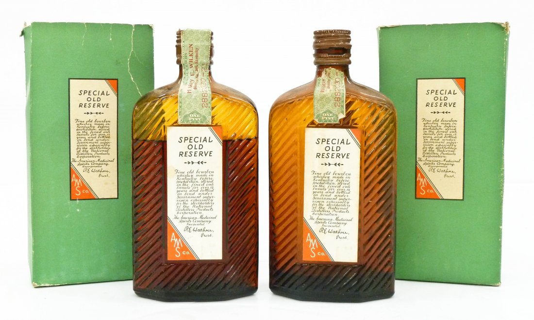 2pc Prohibition Kentucky Bourbon Bottles with Boxes: 2pc Prohibition Kentucky Bourbon Bottles with Boxes 8.5''x4'' Each. Glass whiskey ''Special Old Reserve'' bottles with labels from The American Medicinal Spirits Company. Boxes are missing top flaps a