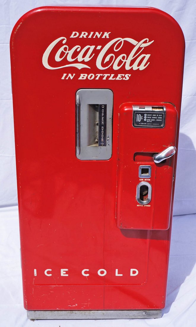 Vintage Coca-Cola Vendo V-39 Coin-Operated Vending: Vintage Coca-Cola Vendo V-39 Coin-Operated Vending Machine 59''x26.5''x24''. Ten cent machine was made from 1949 to 1957 and comes with original service and parts manual. Soda advertising store machin