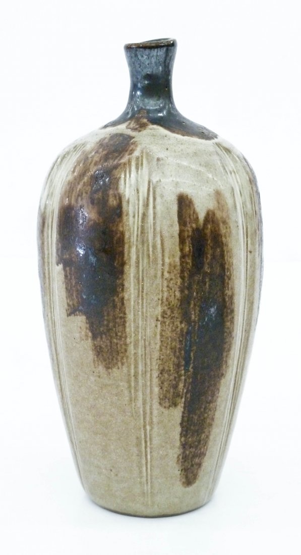 Rupert Deese (1924-2010 California) Stoneware Bottle: Rupert Deese (1924-2010 California) Stoneware Bottle Vase 8.75''x4''. Brown and white drip glazes with artist's paper label on bottom. Excellent condition.