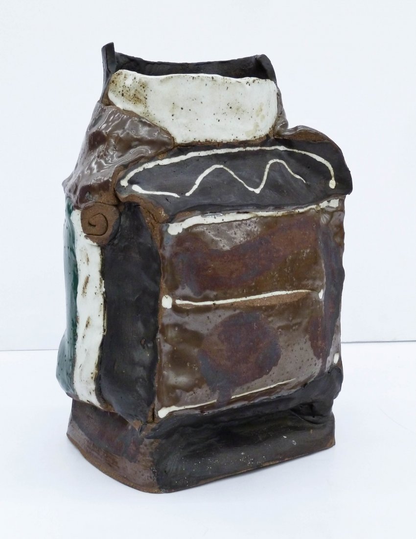 Rudy Autio (1926-2007 Montana) Sculptural Slab Vessel: Rudy Autio (1926-2007 Montana) Sculptural Slab Vessel 1966 Stoneware 14''x9''x8''. An early abstract vessel with polychrome glazes. Signed and dated on bottom. A few small manufacturing flaws, otherwi