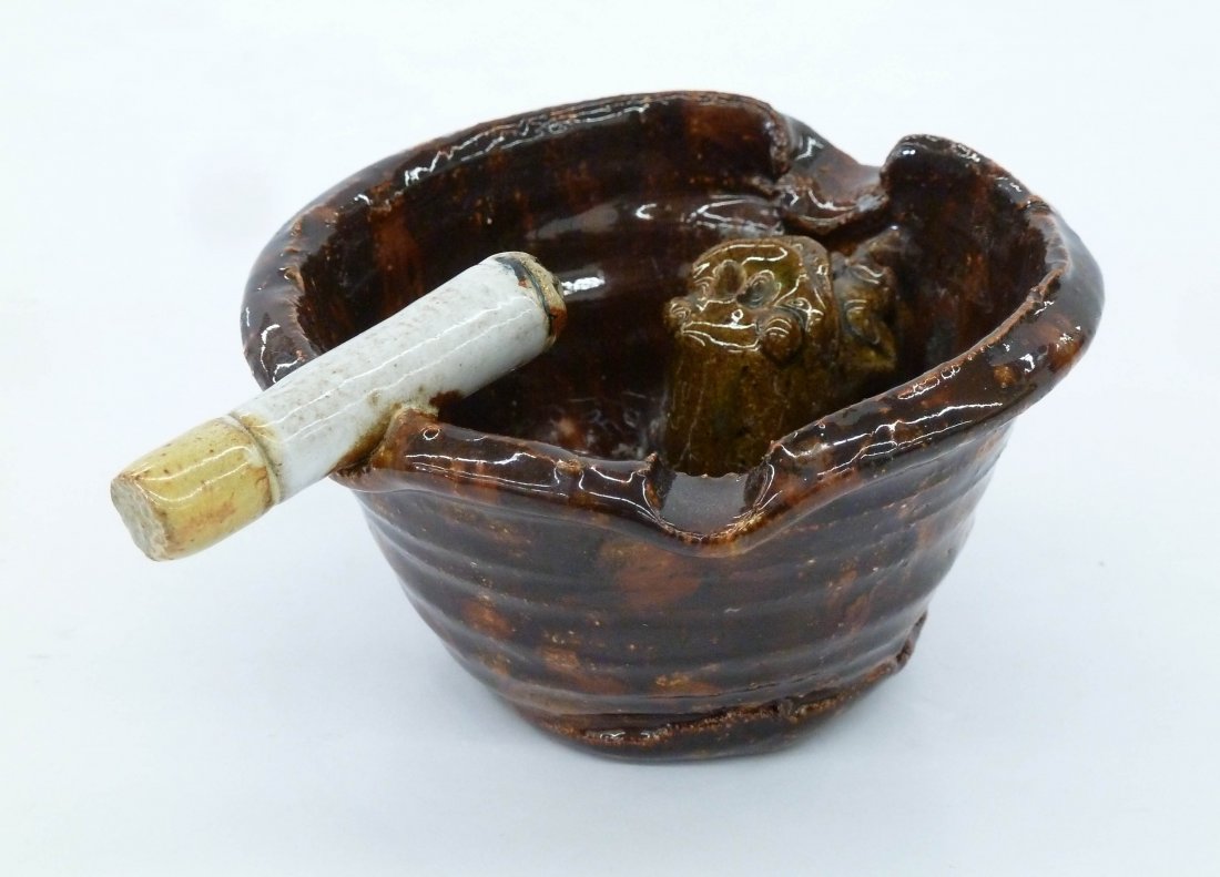 David Gilhooly (1943-2013 California) Frog Ashtray 1974: David Gilhooly (1943-2013 California) Frog Ashtray 1974 Stoneware 2.25''x5''. An early funk pottery wheel thrown ashtray with interior frog and cigarette. Signed and dated on bottom. Excellent conditi