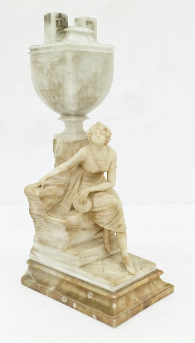 Antique Italian Woman with Tambourine Carved Alabaster: Antique Italian Woman with Tambourine Carved Alabaster Lamp 24''x14''. Depicts a seated girl holding a tambourine with orientalist urn lamp. Urn has Egyptian etched motifs on panels. Signed ''Made in 