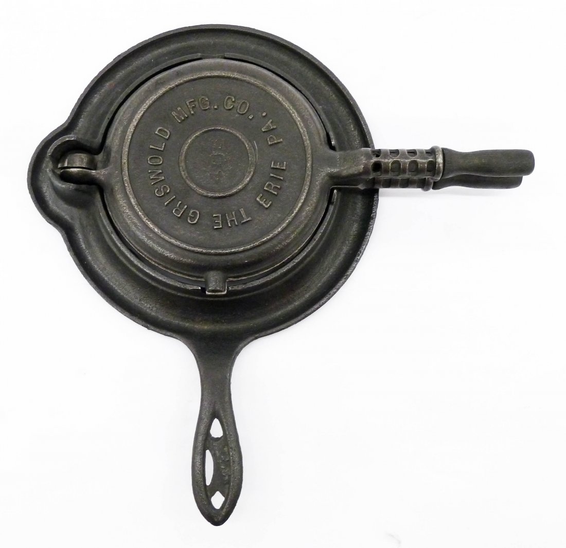 A Rare Griswold 406 Cast Iron Miniature Waffle Iron: A Rare Griswold 406 Cast Iron Miniature Waffle Iron 8''. Salesman sample or doll size. Each piece is numbered 406, 407, and base 408. Excellent original condition.